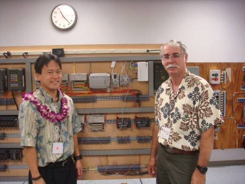 Rep. Jon Riki Karamatsu and a member of the IBEW.